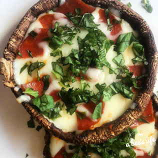 Portobello mushroom pizzas – pepperoni and fresh basil.